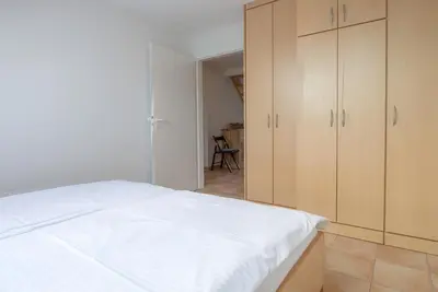 Ein Bett oder Betten in einem Zimmer der Unterkunft Residenz am Strand Wohnung 6-82