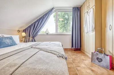 Ein Bett oder Betten in einem Zimmer der Unterkunft Residenz am Strand Seeschwalbe - Wohnung 4-62
