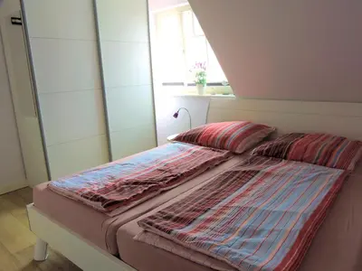 Ein Bett oder Betten in einem Zimmer der Unterkunft Neue Reihe 28 - Wohnung Wolke 7