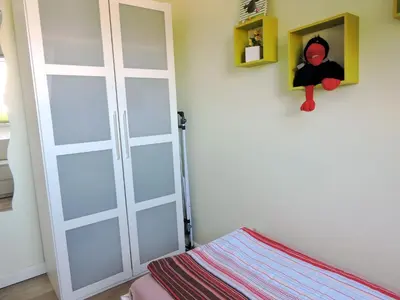 Ein Bett oder Betten in einem Zimmer der Unterkunft Neue Reihe 28 - Wohnung Wolke 7