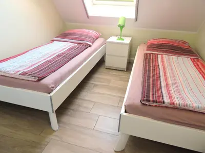 Ein Bett oder Betten in einem Zimmer der Unterkunft Neue Reihe 28 - Wohnung Wolke 7