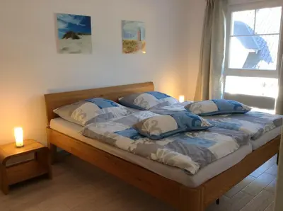 Ein Bett oder Betten in einem Zimmer der Unterkunft Hafenstrasse 15 Wolkenglanz in Prerow