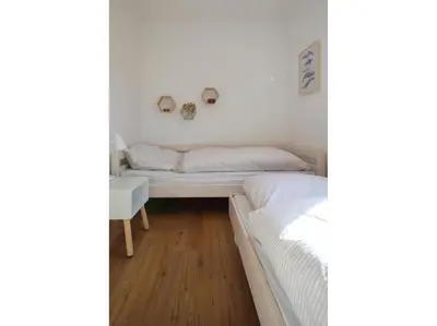 Ein Bett oder Betten in einem Zimmer der Unterkunft Zur Hanse Wohnung 1 1