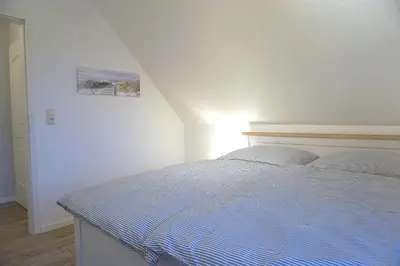 Ein Bett oder Betten in einem Zimmer der Unterkunft Zur Hanse Wohnung 1 4