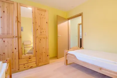 Ein Bett oder Betten in einem Zimmer der Unterkunft Zur Hanse Wohnung 4 2