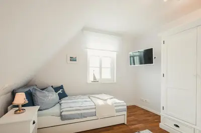 Ein Bett oder Betten in einem Zimmer der Unterkunft Pinne