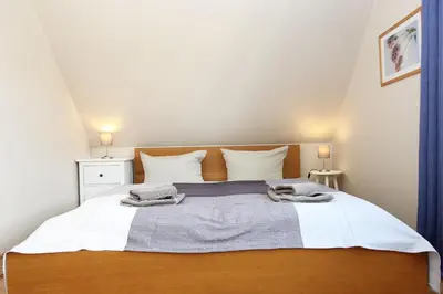 Ein Bett oder Betten in einem Zimmer der Unterkunft Achtern-Stems 2