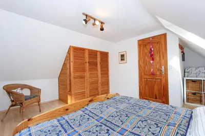 Ein Bett oder Betten in einem Zimmer der Unterkunft Nordlicht