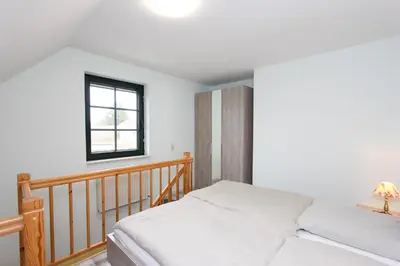 Ein Bett oder Betten in einem Zimmer der Unterkunft Oliver-Grolik