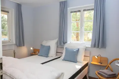 Ein Bett oder Betten in einem Zimmer der Unterkunft Strandmuschel