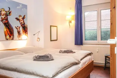 Ein Bett oder Betten in einem Zimmer der Unterkunft Kormoran Pusteblume