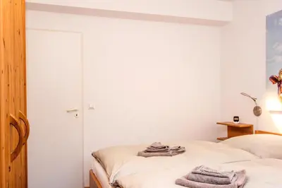 Ein Bett oder Betten in einem Zimmer der Unterkunft Kormoran Pusteblume