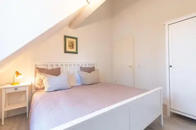 Ein Bett oder Betten in einem Zimmer der Unterkunft Darsser Freiraum