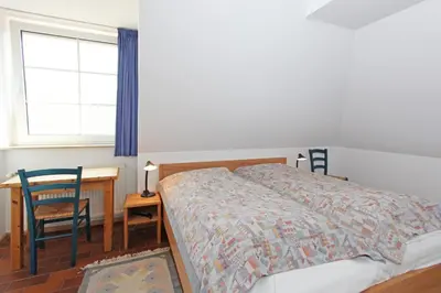 Ein Bett oder Betten in einem Zimmer der Unterkunft Kormoran Meerjungfrau