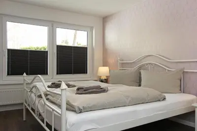 Ein Bett oder Betten in einem Zimmer der Unterkunft Lieblingshaus Tilda