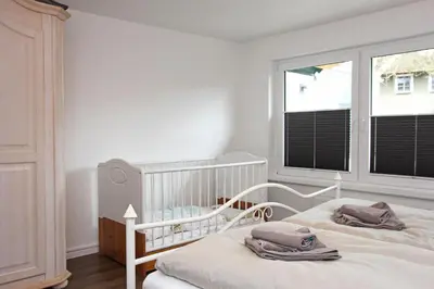 Ein Bett oder Betten in einem Zimmer der Unterkunft Lieblingshaus Tilda