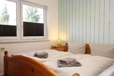 Ein Bett oder Betten in einem Zimmer der Unterkunft Lieblingshaus Eddie