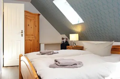 Ein Bett oder Betten in einem Zimmer der Unterkunft Lieblingshaus Fiete
