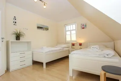 Ein Bett oder Betten in einem Zimmer der Unterkunft Darß Idyll
