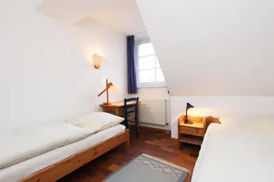 Ein Bett oder Betten in einem Zimmer der Unterkunft Kormoran G6