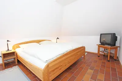 Ein Bett oder Betten in einem Zimmer der Unterkunft Kormoran G6