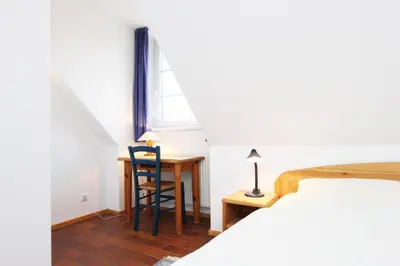 Ein Bett oder Betten in einem Zimmer der Unterkunft Kormoran G6