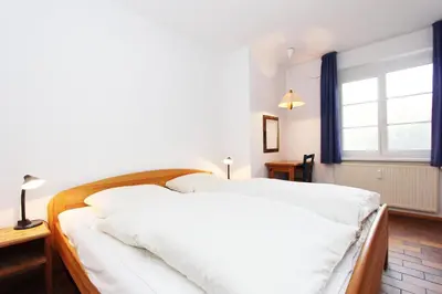 Ein Bett oder Betten in einem Zimmer der Unterkunft Kormoran G2