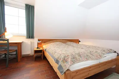 Ein Bett oder Betten in einem Zimmer der Unterkunft Kormoran Wolke 7