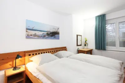 Ein Bett oder Betten in einem Zimmer der Unterkunft Kormoran Meersommer