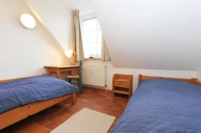 Ein Bett oder Betten in einem Zimmer der Unterkunft Kormoran Wald und Strand