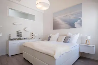 Ein Bett oder Betten in einem Zimmer der Unterkunft Ferienwohnung Düne 18