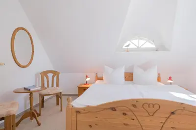 Ein Bett oder Betten in einem Zimmer der Unterkunft Born - Wieck Ferienwohnung Romantik