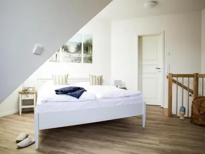 Ein Bett oder Betten in einem Zimmer der Unterkunft Ferienwohnung, Zingst
