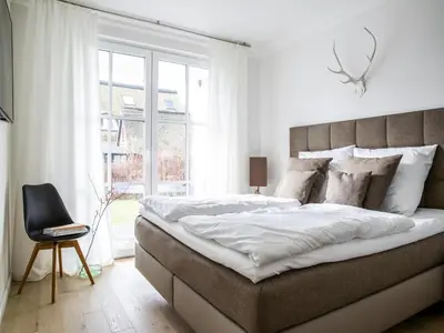 Ein Bett oder Betten in einem Zimmer der Unterkunft Ferienwohnung, Zingst