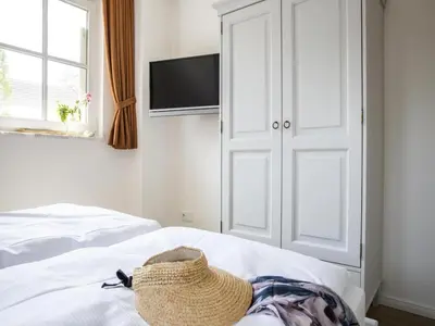 Ein Bett oder Betten in einem Zimmer der Unterkunft Ferienwohnung, Zingst
