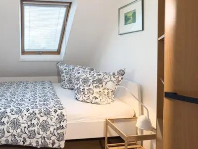 Ein Bett oder Betten in einem Zimmer der Unterkunft Strandläufer