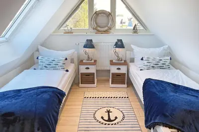 Ein Bett oder Betten in einem Zimmer der Unterkunft Zeeskahn