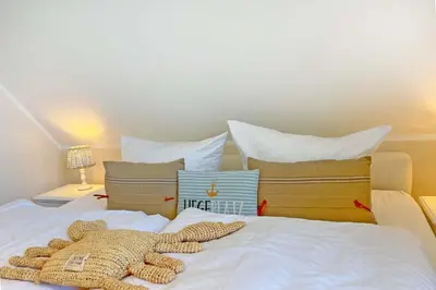 Ein Bett oder Betten in einem Zimmer der Unterkunft Zeeskahn