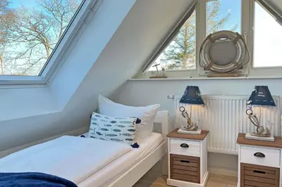 Ein Bett oder Betten in einem Zimmer der Unterkunft Zeeskahn