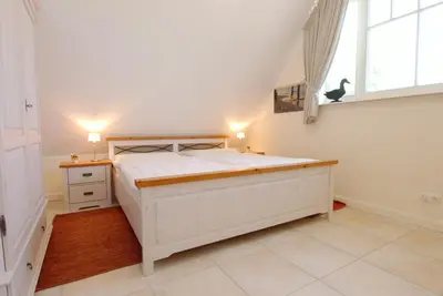Ein Bett oder Betten in einem Zimmer der Unterkunft Neue Reihe 28 - Wohnung Ankerplatz