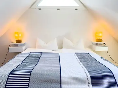 Ein Bett oder Betten in einem Zimmer der Unterkunft Haus am kleinen Hafen No. 2