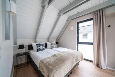 Ein Bett oder Betten in einem Zimmer der Unterkunft Haus Strandflieder - Kamin, Sauna & Terrasse