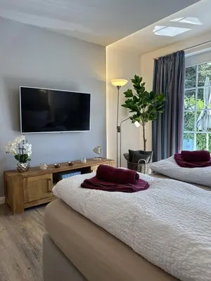 Ein Bett oder Betten in einem Zimmer der Unterkunft Gästehaus W 2
