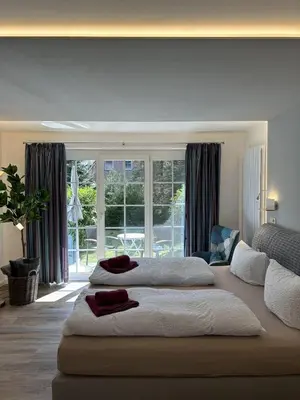 Ein Bett oder Betten in einem Zimmer der Unterkunft Gästehaus W 2