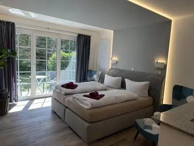 Ein Bett oder Betten in einem Zimmer der Unterkunft Gästehaus W 2