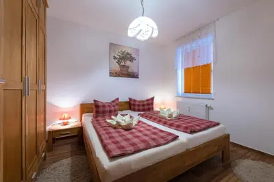 Ein Bett oder Betten in einem Zimmer der Unterkunft Gästehaus W 4 - Perlentaucher