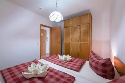 Ein Bett oder Betten in einem Zimmer der Unterkunft Gästehaus W 4 - Perlentaucher