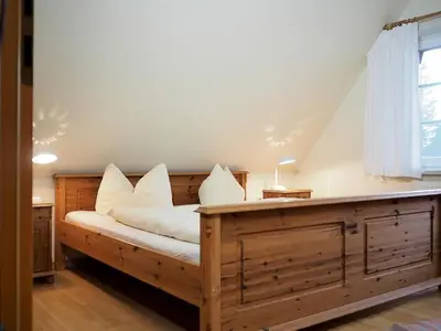 Ein Bett oder Betten in einem Zimmer der Unterkunft Doppelhaus 9 - Strandkorb