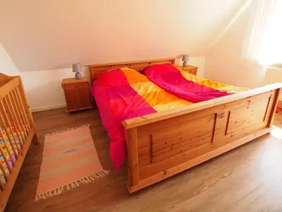 Ein Bett oder Betten in einem Zimmer der Unterkunft Doppelhaus 9 - Strandkorb