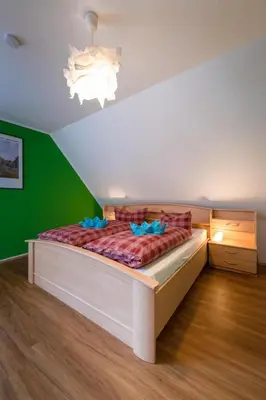 Ein Bett oder Betten in einem Zimmer der Unterkunft Doppelhaus 7 - Wiesengrund
